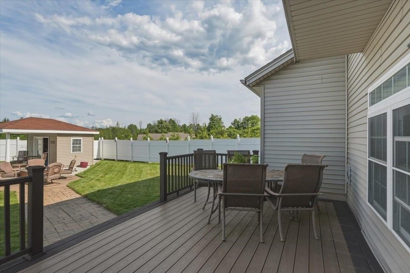 Set on 1.17 private acres in the heart of Grand Isle, this - photo 5