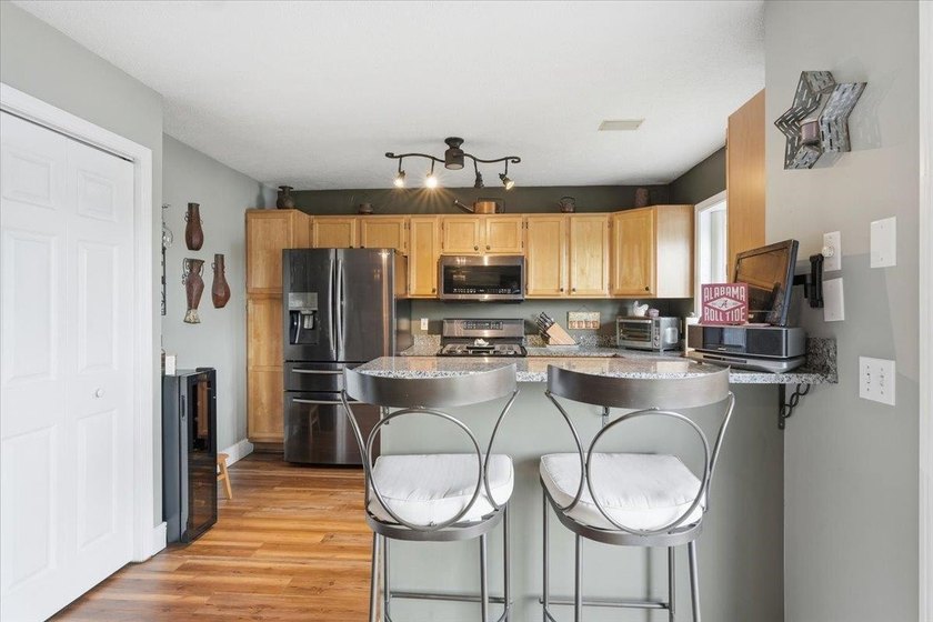 Set on 1.17 private acres in the heart of Grand Isle, this - photo 10