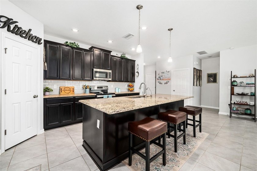 This stunning 2020 David Weekley home perfectly blends modern - photo 11