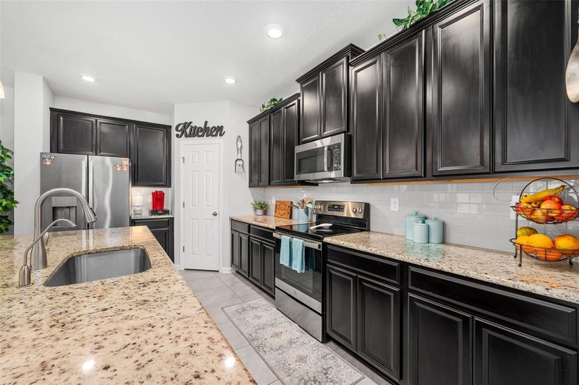 This stunning 2020 David Weekley home perfectly blends modern - photo 12
