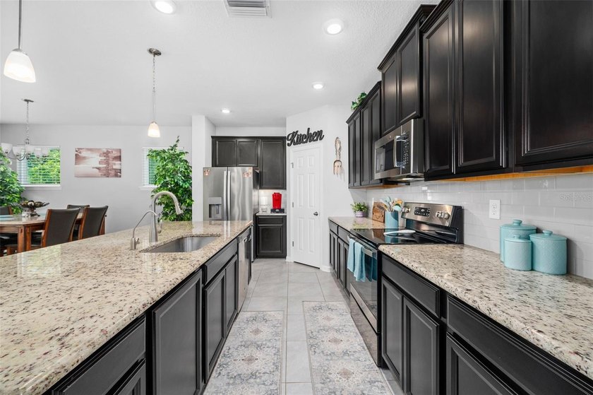 This stunning 2020 David Weekley home perfectly blends modern - photo 13