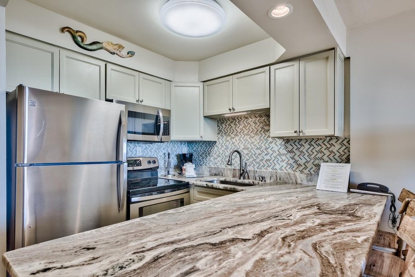 Jetty East is a Gulf front Gated 6-story midrise with under - photo 9
