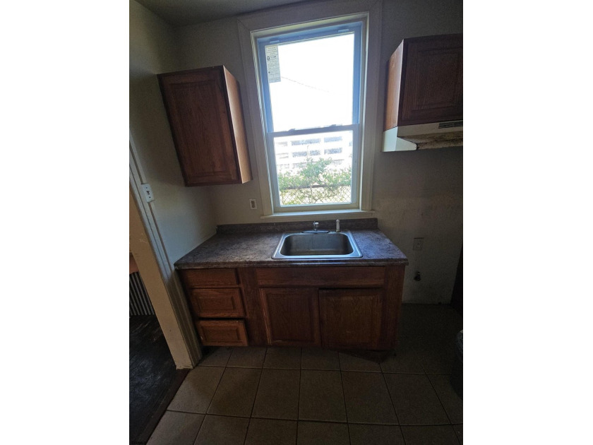 Prime Location with Exceptional Potential! This 3-bedroom - photo 9