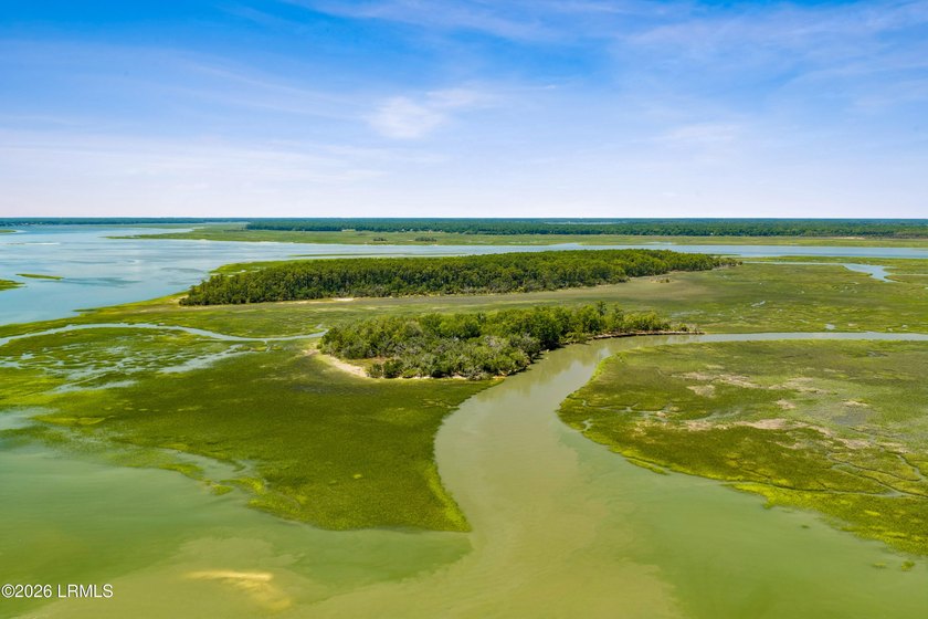 Discover an extraordinary 8-acre private island paradise, where - photo 3
