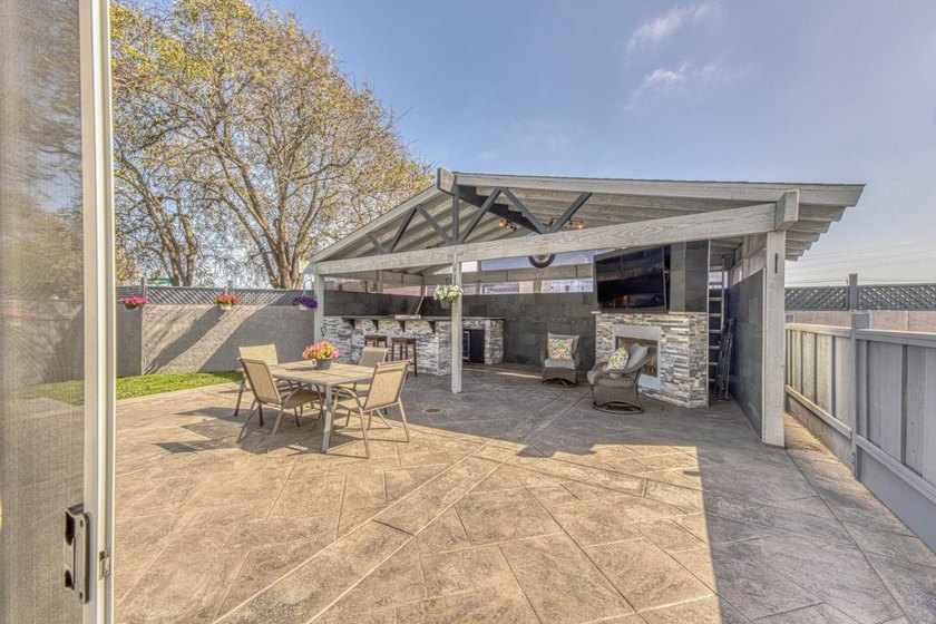 The backyard alone will sell this house. A custom covered - photo 23