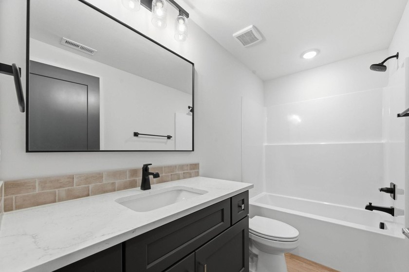 Step into modern comfort with this stunning new construction - photo 26