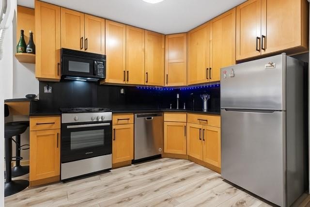 Spacious 1-Bedroom with Balcony at 61-20 Grand Central Parkway - photo 10