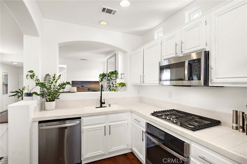 Bright, welcoming and impressively updated inside and out, this - photo 18