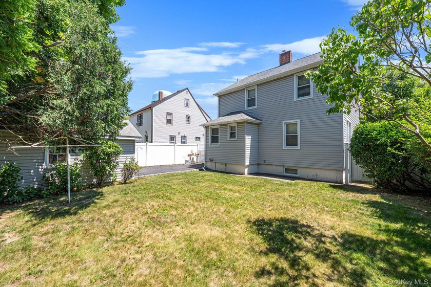 Welcome Home To This Charming Merrick Cape Cod Nestled Mid Block - photo 20