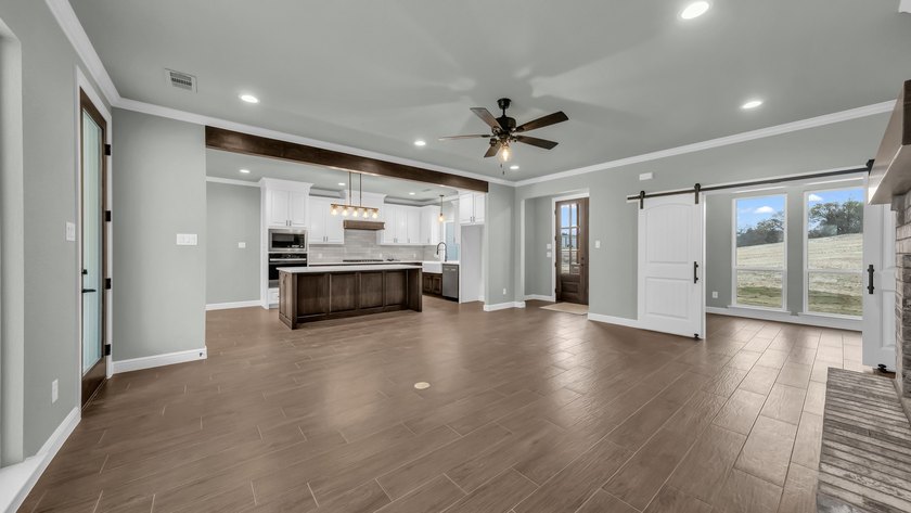This proposed Ava plan features 3 beds 2 full baths, a - photo 8