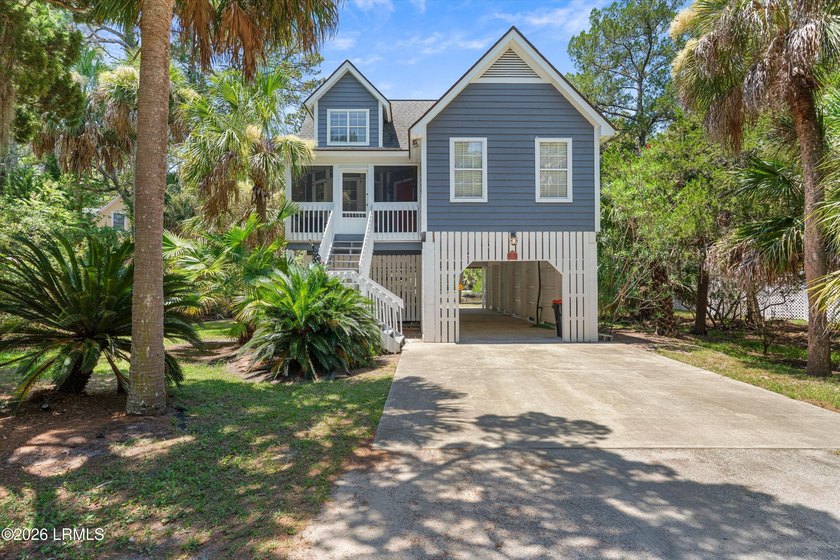 Tucked away within the gated community of Harbor Island, this - photo 3