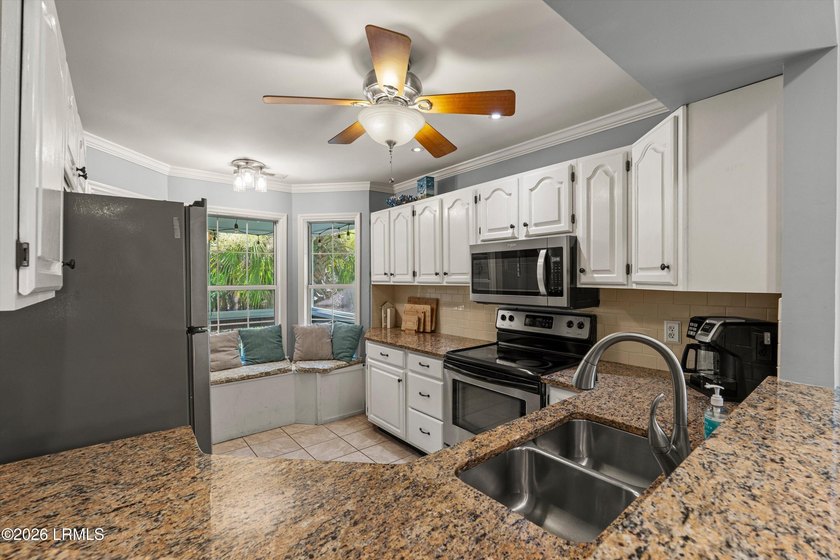 Tucked away within the gated community of Harbor Island, this - photo 8
