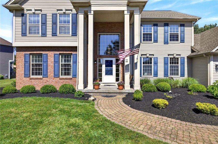 Set on nearly half an acre in a sought-after Penfield - photo 2