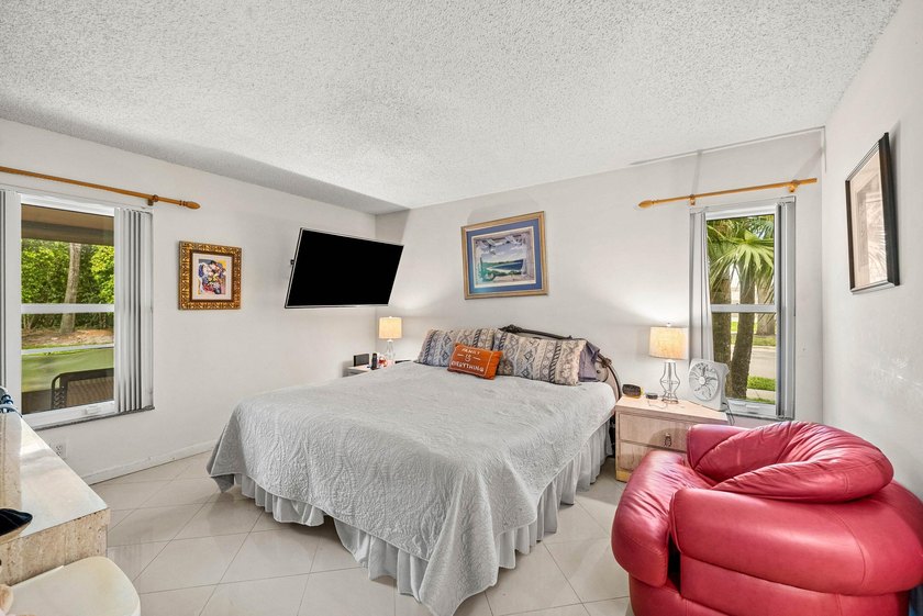 Tucked away as a private end-unit in desirable Town Villas, this - photo 18