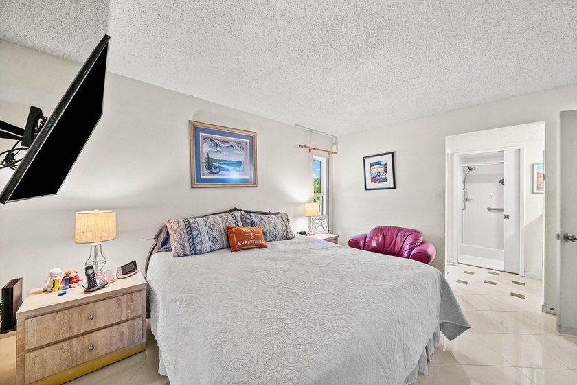 Tucked away as a private end-unit in desirable Town Villas, this - photo 19