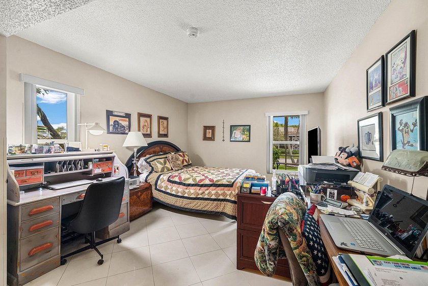 Tucked away as a private end-unit in desirable Town Villas, this - photo 21