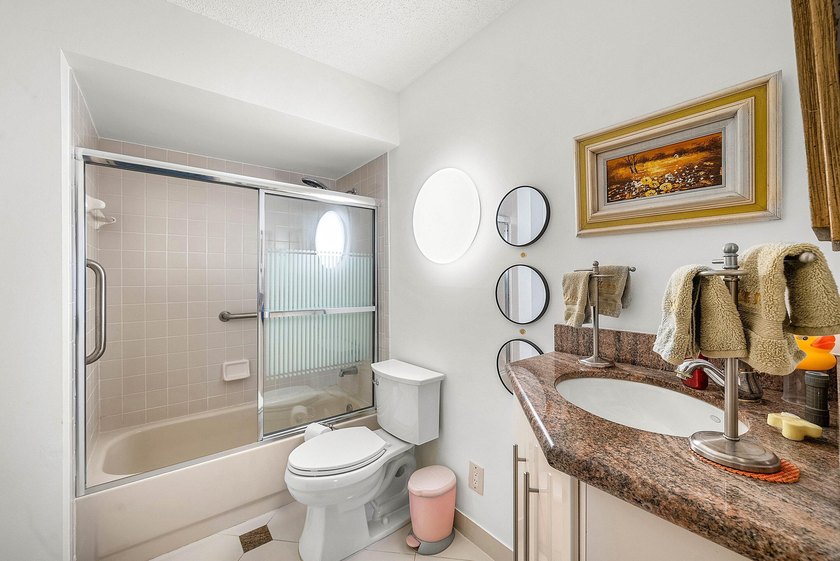 Tucked away as a private end-unit in desirable Town Villas, this - photo 24