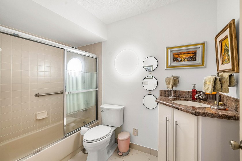 Tucked away as a private end-unit in desirable Town Villas, this - photo 25