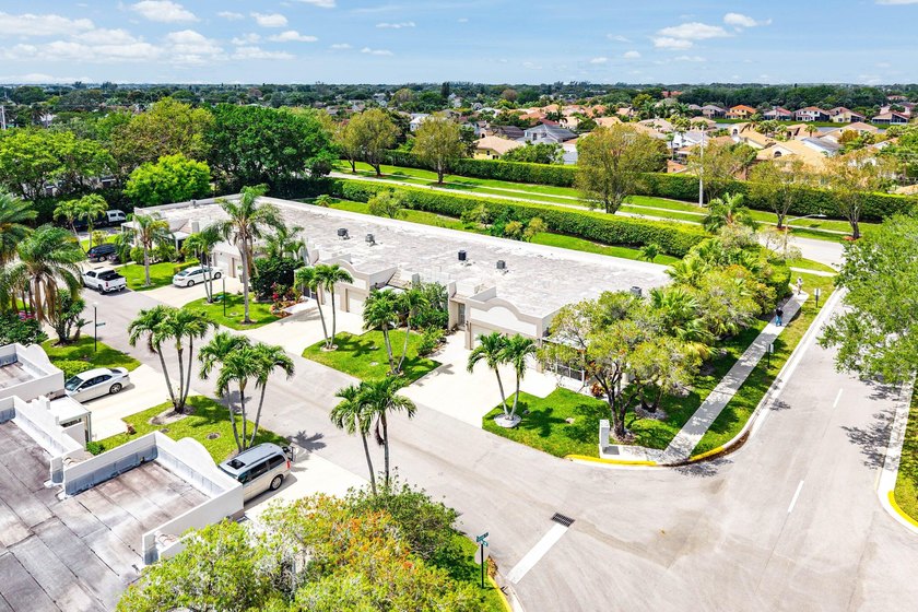 Tucked away as a private end-unit in desirable Town Villas, this - photo 34