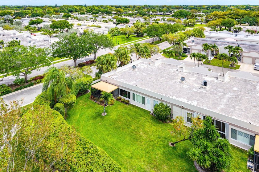 Tucked away as a private end-unit in desirable Town Villas, this - photo 40
