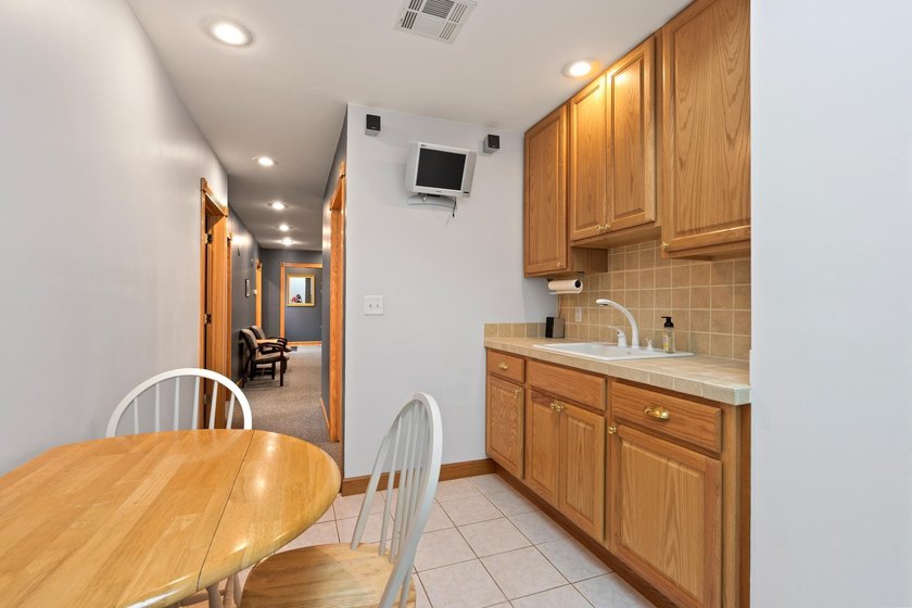 The main level offers 1,365 square feet, providing four offices - photo 11