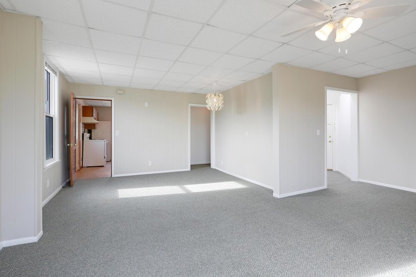 The main level offers 1,365 square feet, providing four offices - photo 19