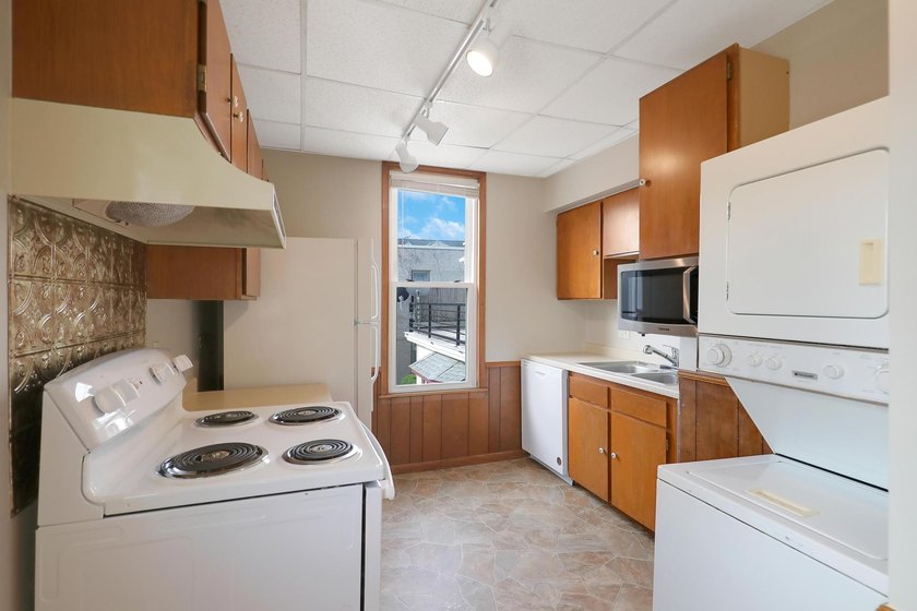 The main level offers 1,365 square feet, providing four offices - photo 20