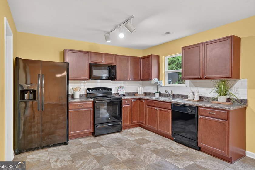 This charming 4-bedroom, 2.5-bath residence offers the ideal - photo 7