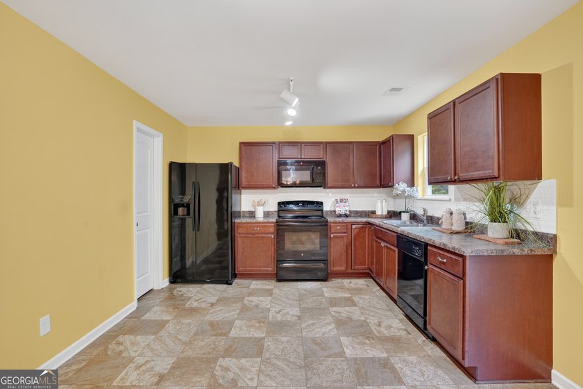 This charming 4-bedroom, 2.5-bath residence offers the ideal - photo 8