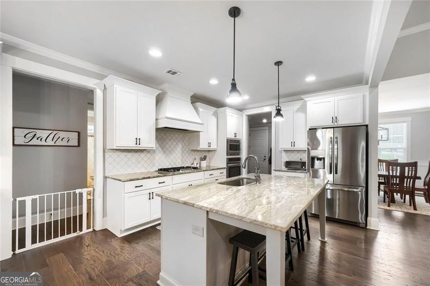 Welcome home to 115 Rowboat Drive, a gorgeous craftsman tucked - photo 8