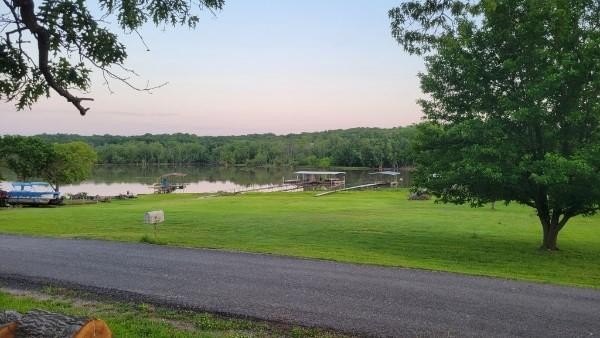 Escape to lake life with this charming retreat just seconds from - photo 13