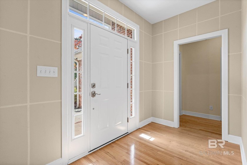 This Fairhope single-story 3BR/2BA Patio home features Hardwood - photo 3