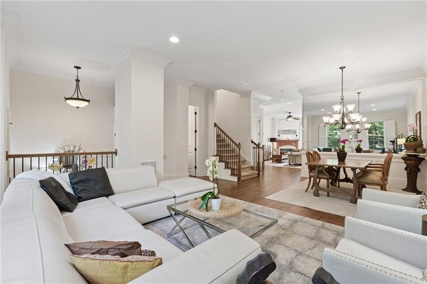 Set behind the gates of One Ivy Walk, this brick townhome offers - photo 2