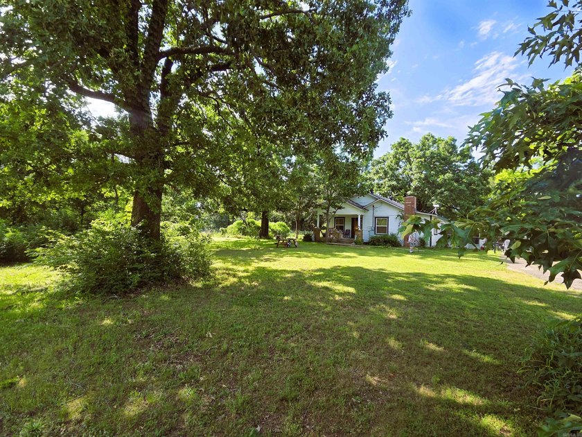 Charming Mena Home with Modern Upgrades &amp; Endless Potential! - photo 33