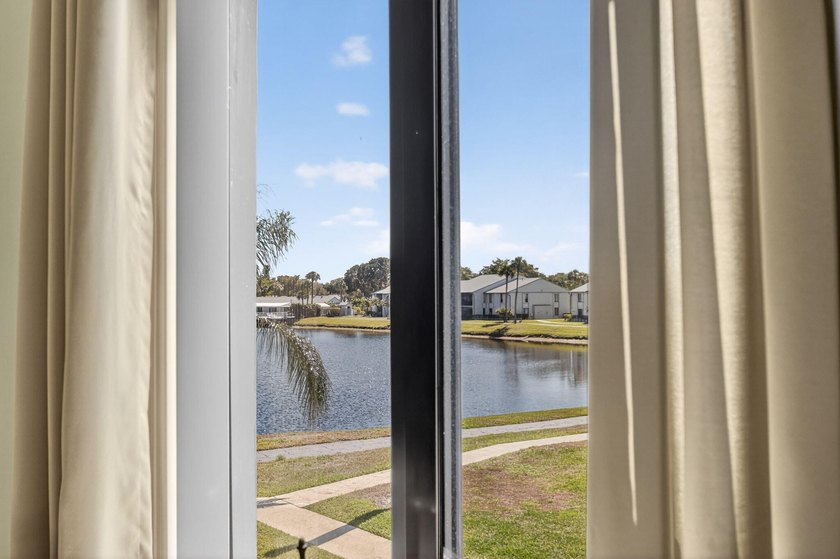 This corner unit, located on the 2nd floor, boasts impact glass - photo 12