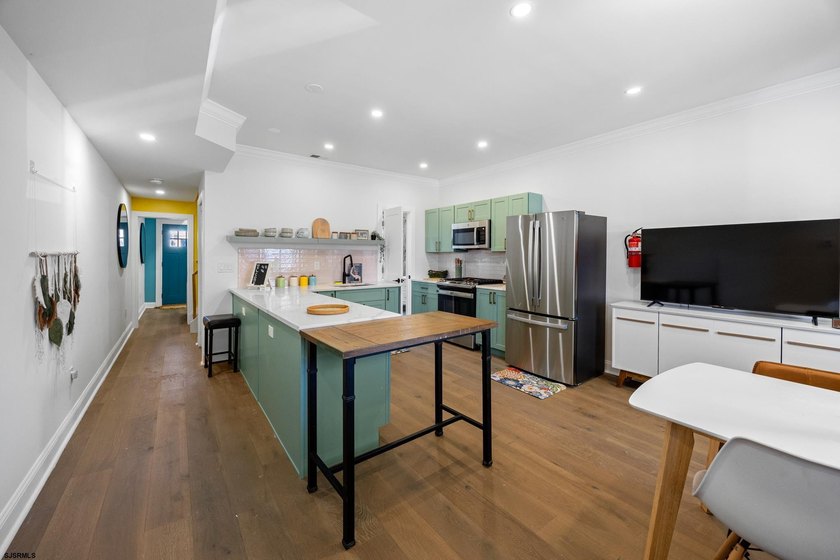 Live the coastal dream and earn from it! This fully renovated - photo 3