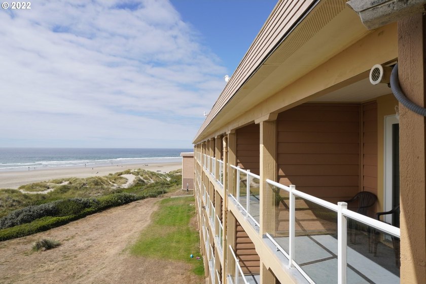 Oceanfront living at its best! A rare TOP floor unit ensures a - photo 2