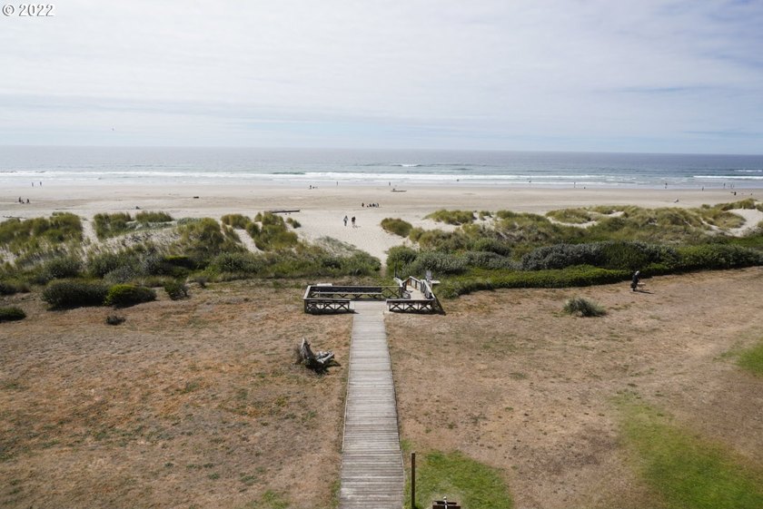 Oceanfront living at its best! A rare TOP floor unit ensures a - photo 3