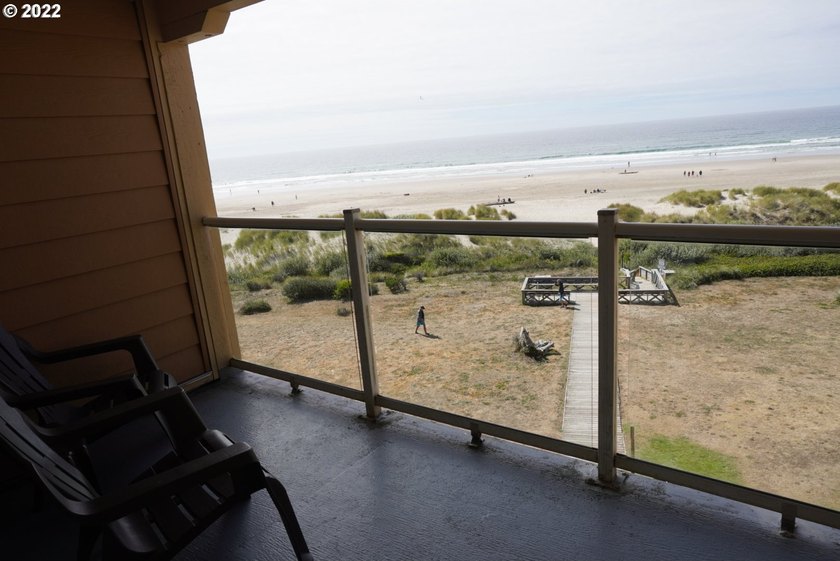 Oceanfront living at its best! A rare TOP floor unit ensures a - photo 4