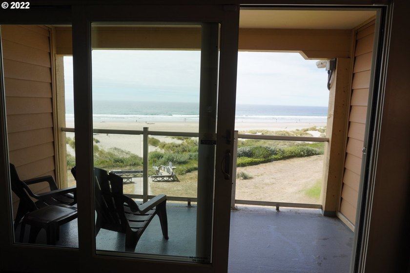 Oceanfront living at its best! A rare TOP floor unit ensures a - photo 5