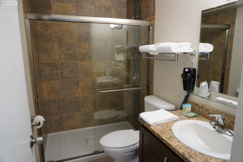 Oceanfront living at its best! A rare TOP floor unit ensures a - photo 7