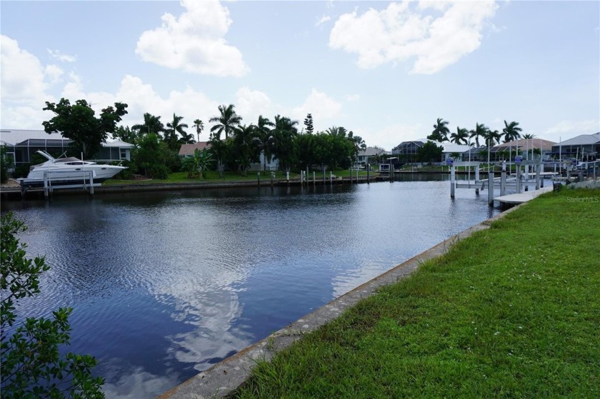 PRIME PGI WATERFRONT LOT WITH CONCRETE SEAWALL AND A SOUTHERN - photo 4