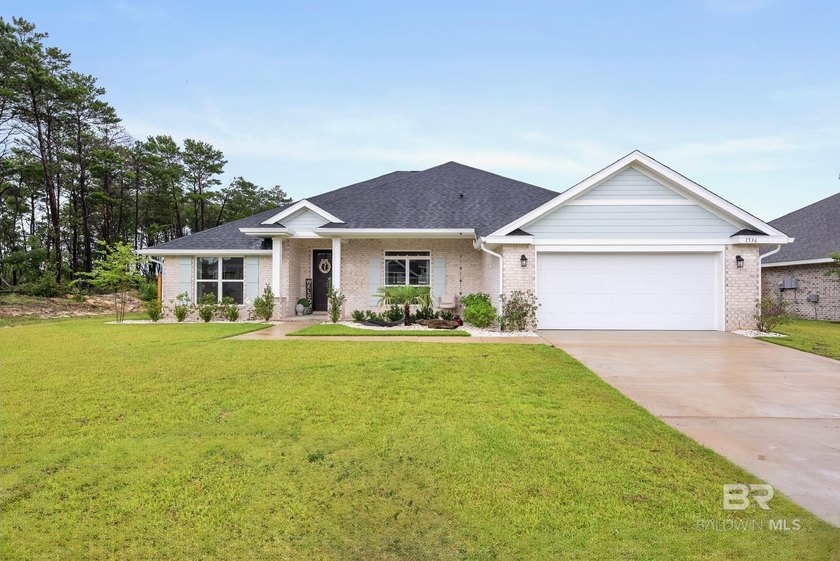 Resort-style living starts in the backyard of this beautifully - photo 2