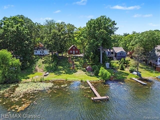 Escape to the peaceful living beauty of lake living in this - photo 27