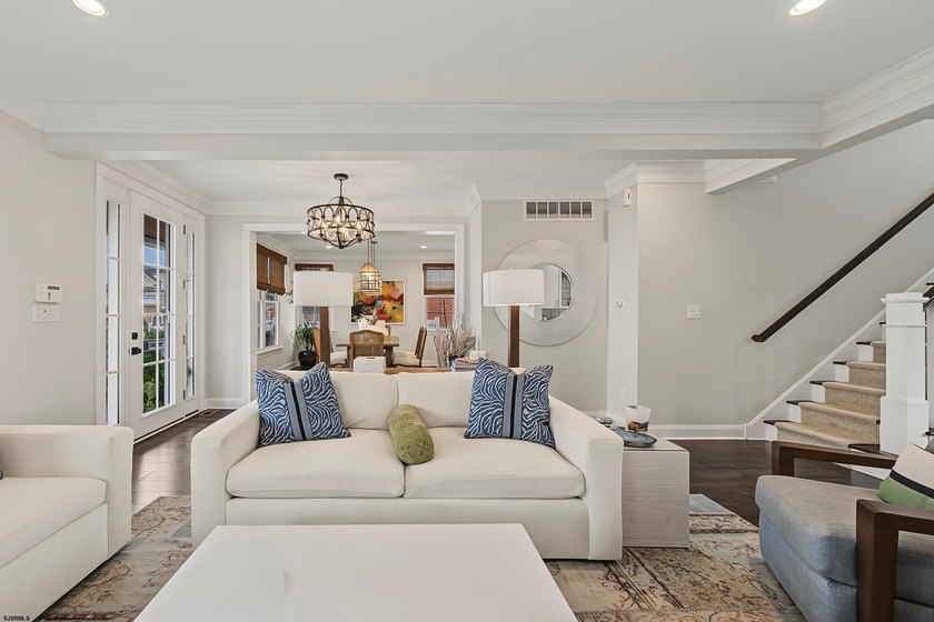 JUST FOUR HOMES FROM THE BEACH! Welcome to one of the most - photo 11