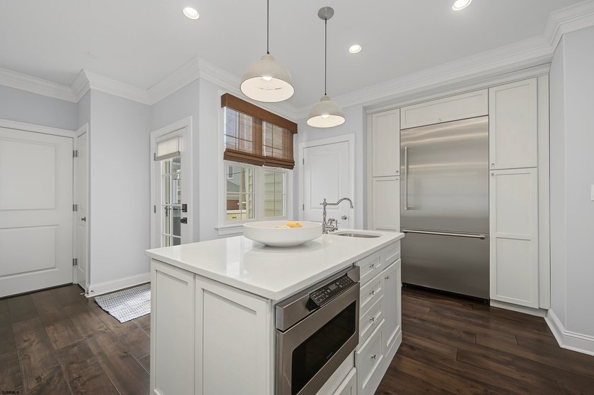 JUST FOUR HOMES FROM THE BEACH! Welcome to one of the most - photo 23