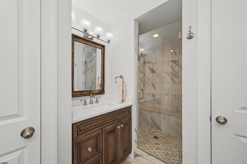JUST FOUR HOMES FROM THE BEACH! Welcome to one of the most - photo 32