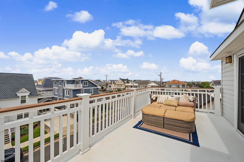 JUST FOUR HOMES FROM THE BEACH! Welcome to one of the most - photo 43