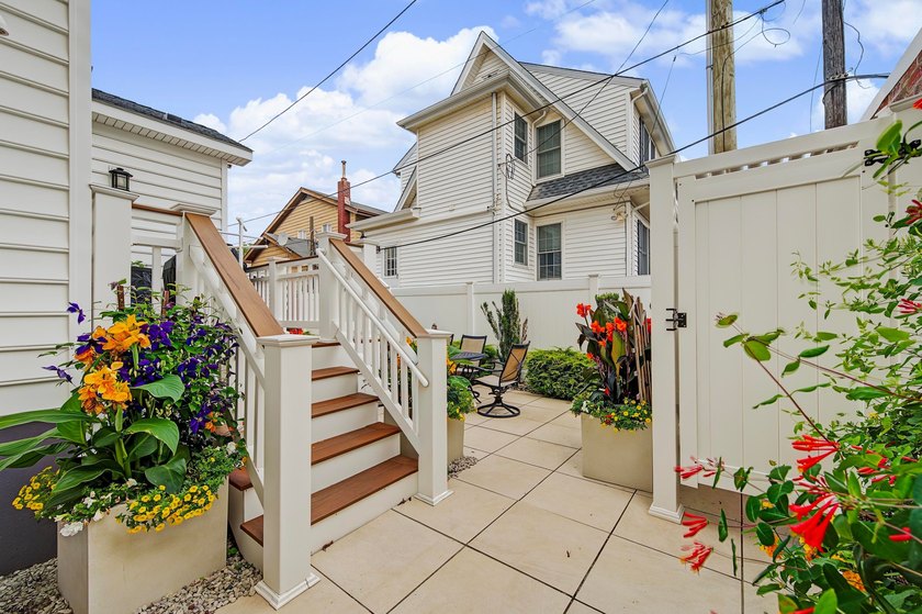 JUST FOUR HOMES FROM THE BEACH! Welcome to one of the most - photo 50