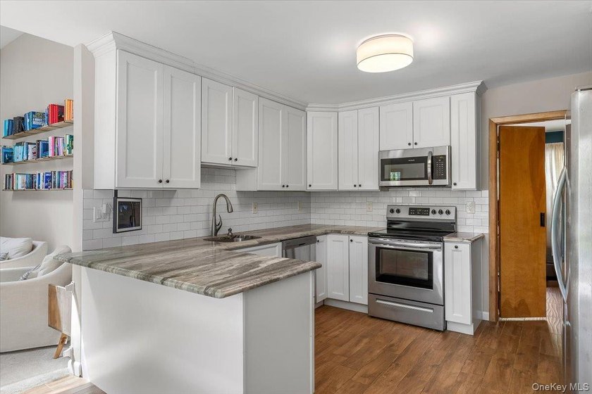 Your out-east living is here! This homey ranch is situated on - photo 9